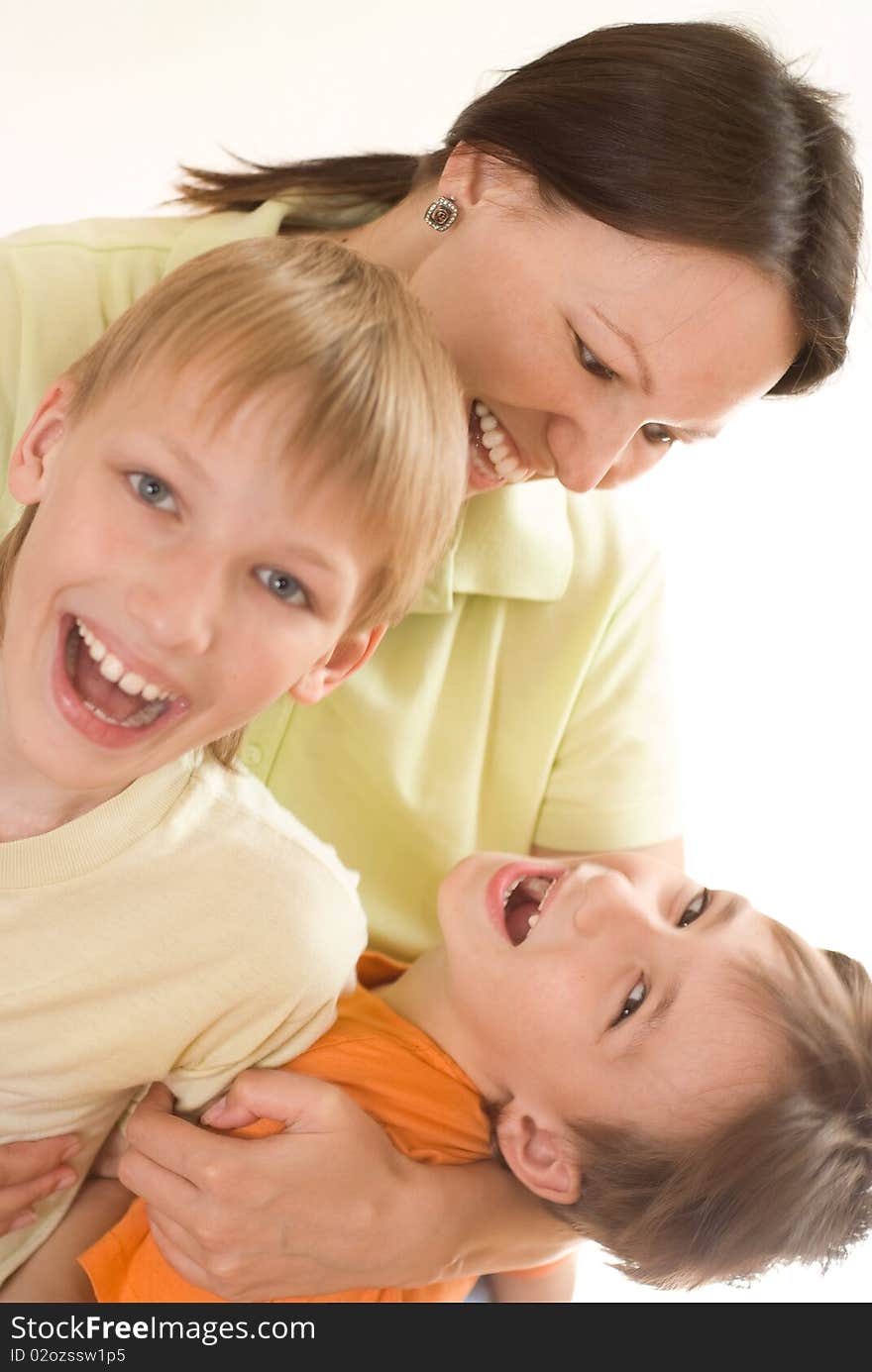 Happy mom and children on a white background