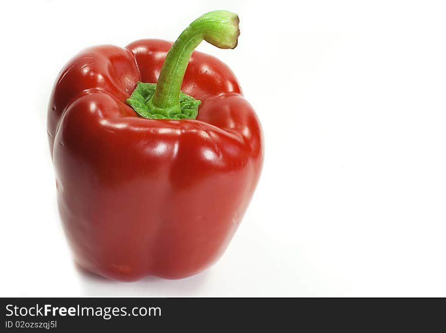 A red bell pepper straight up, isolated on white background with plenty of copy space.