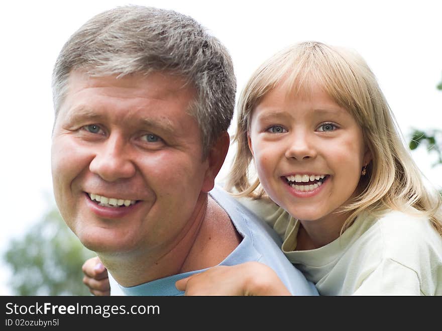 Happy father and daughter in summer park