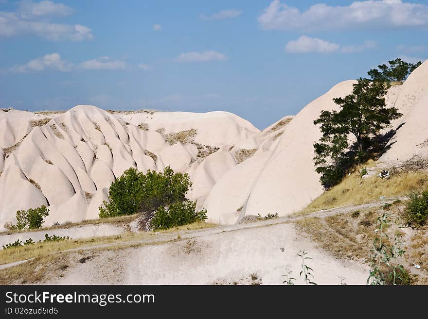 Hills of sandstone formed by weathering of soil in Kappadikia district, Turkey. Hills of sandstone formed by weathering of soil in Kappadikia district, Turkey