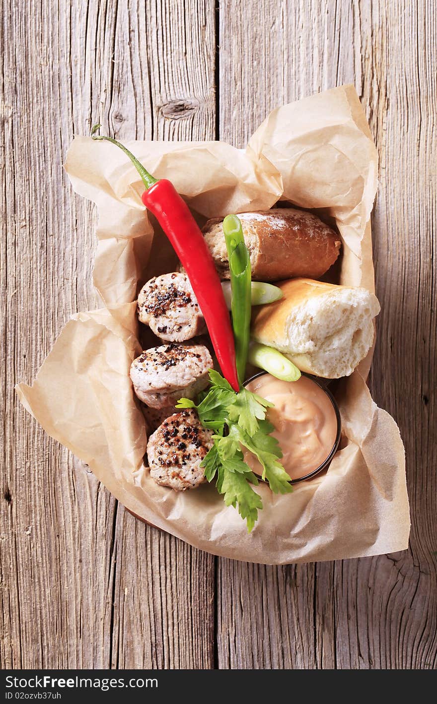 Roast pork filet mignons with bread and sauce