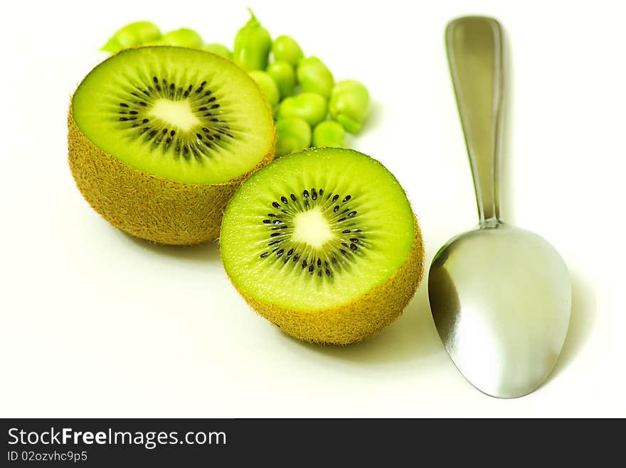 Kiwis with spoon on white background