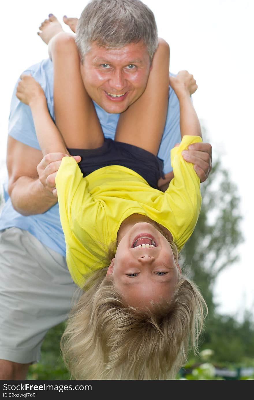 Happy father and daughter in summer park