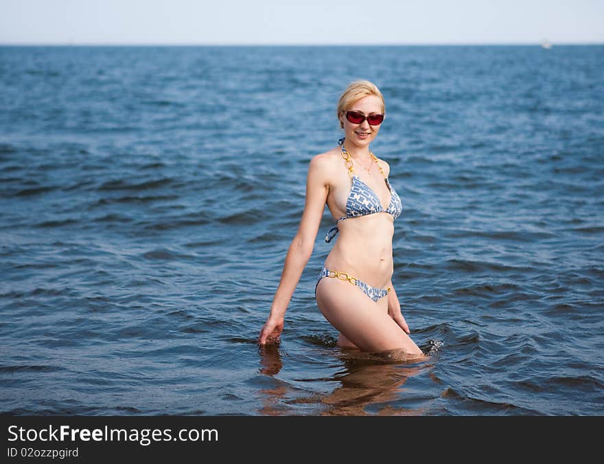 Young beautiful woman  on the beach. Young beautiful woman  on the beach