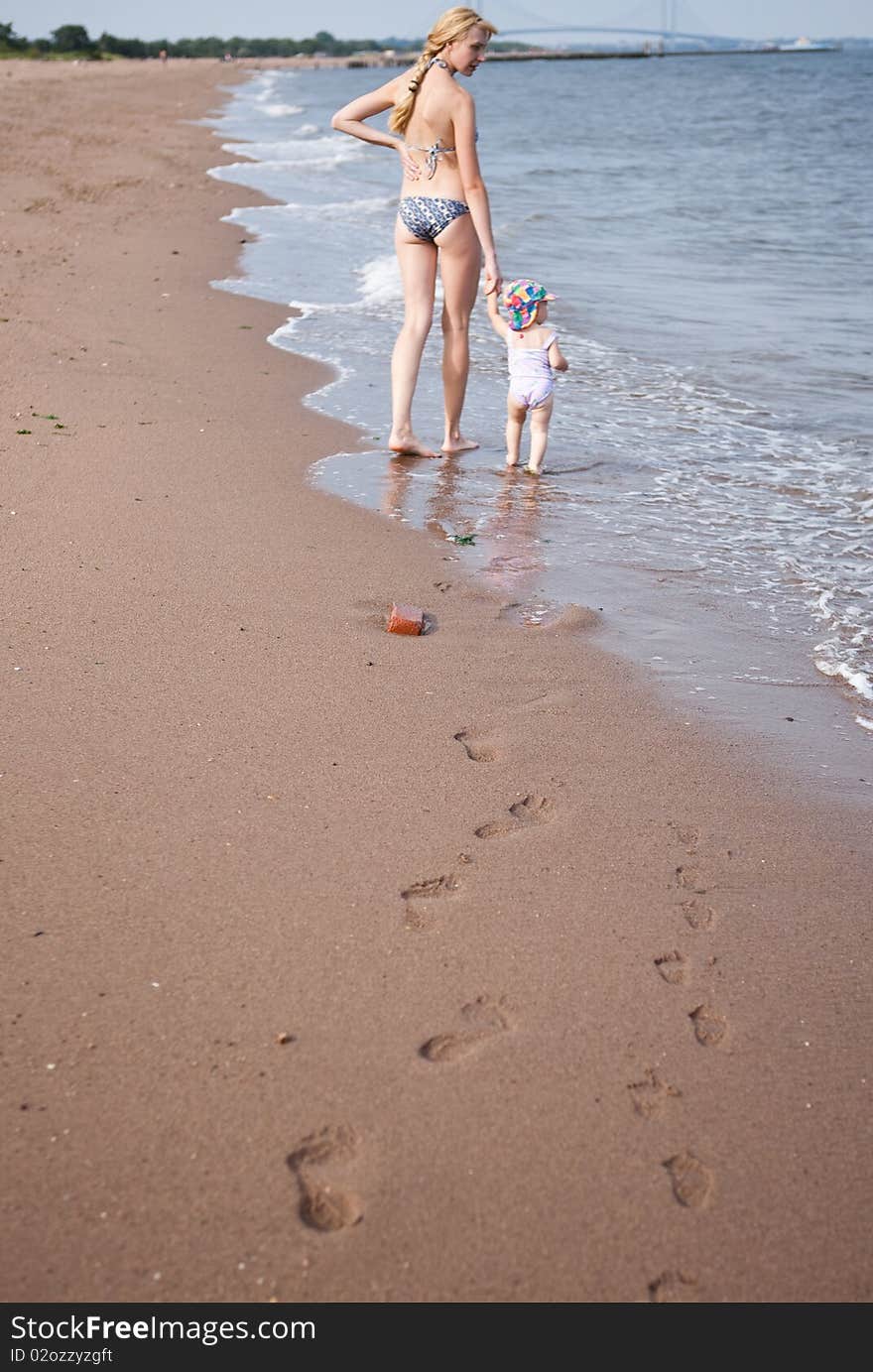 Mother with the baby on the beach. Mother with the baby on the beach