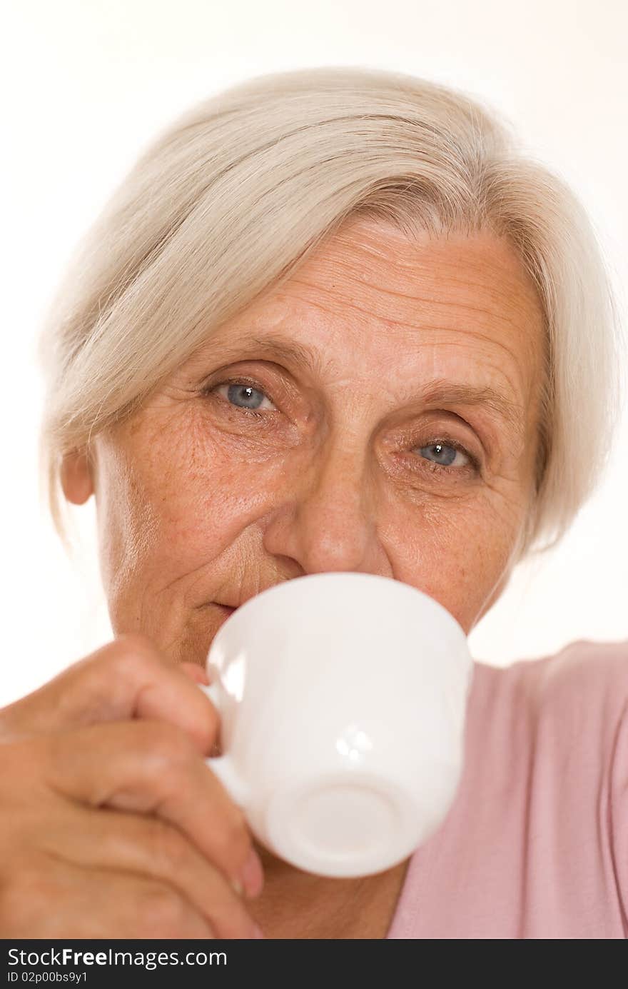 Beautiful older woman on a white background