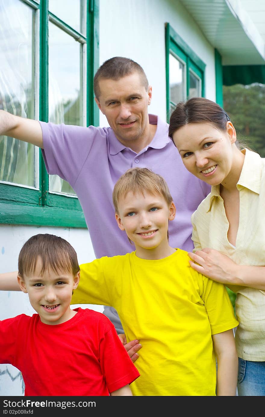 Portrait of a happy family playing outdoors