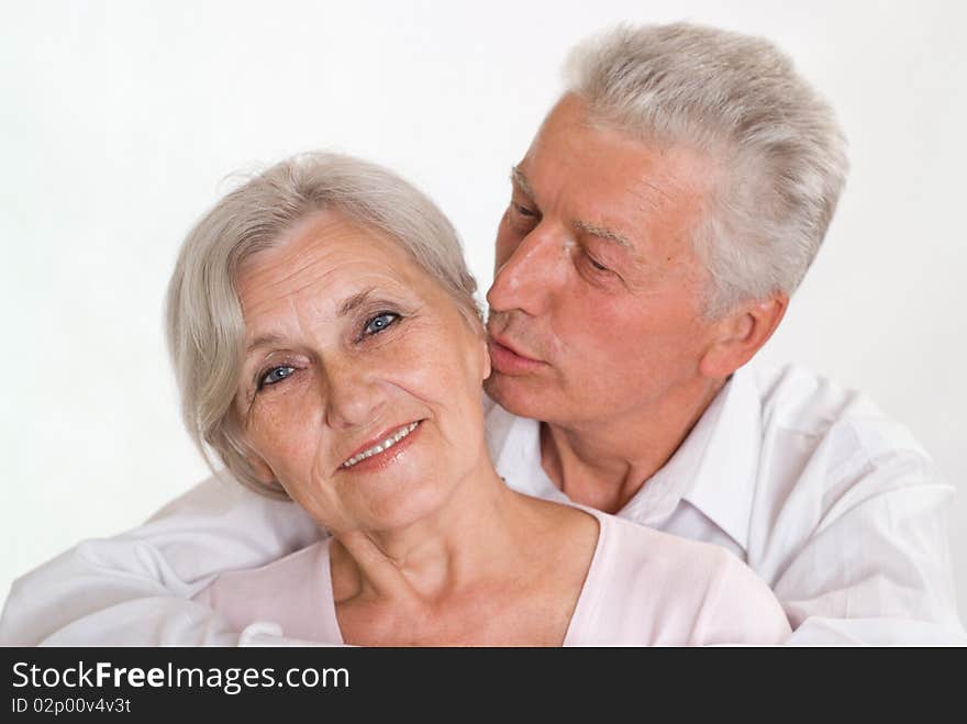 Happy elderly couple together on a white background. Happy elderly couple together on a white background