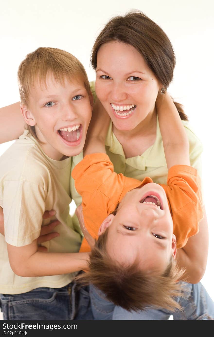 Happy mom and children on a white background