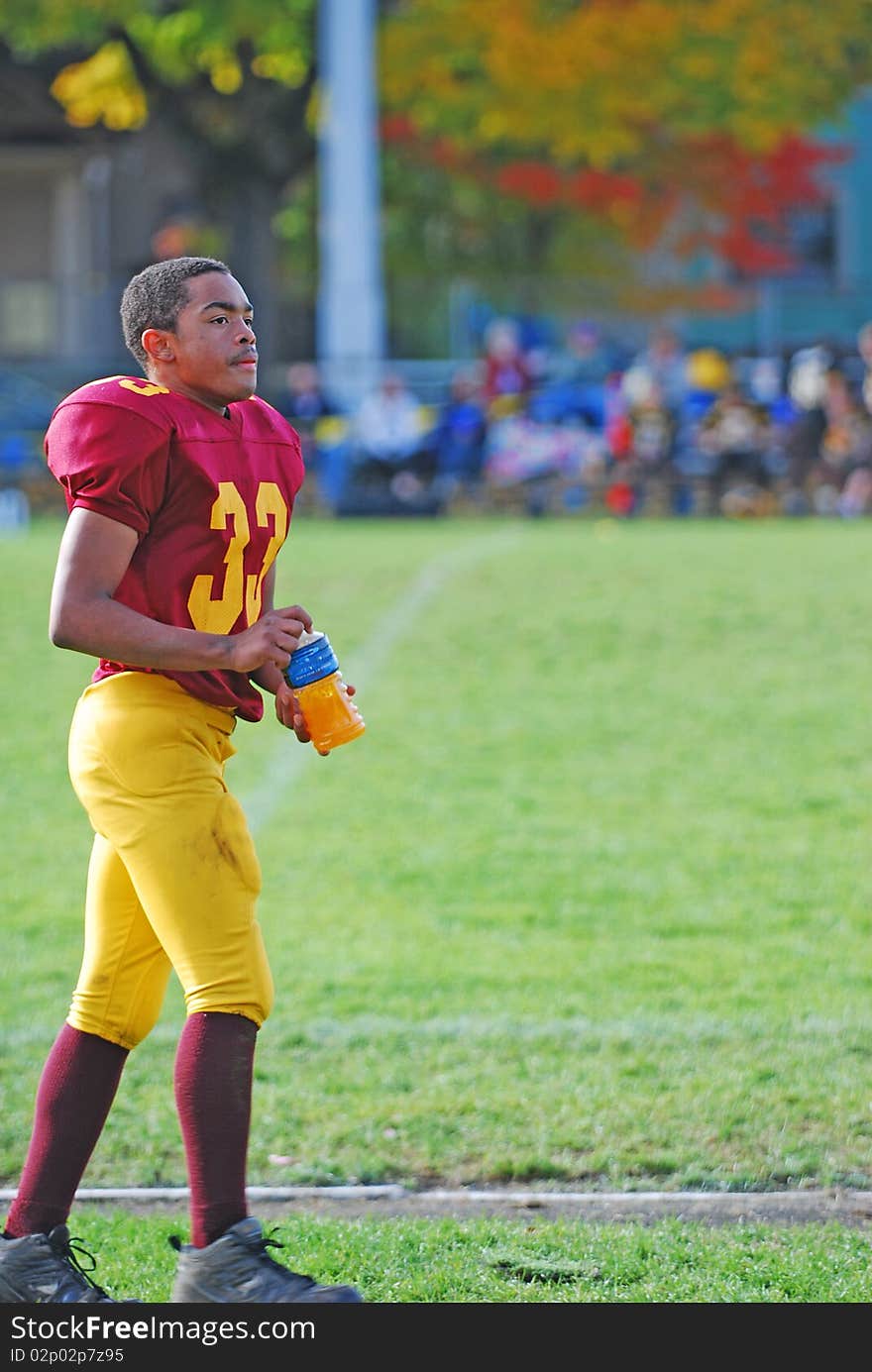 A young African American on the practise field before a game. A young African American on the practise field before a game