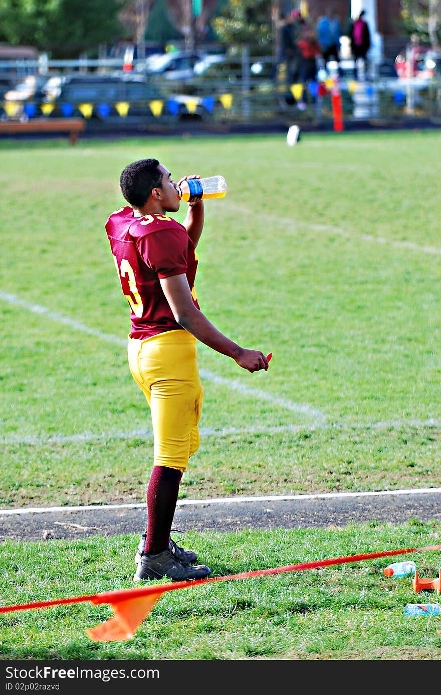 A young African American on the practise field before a game. A young African American on the practise field before a game