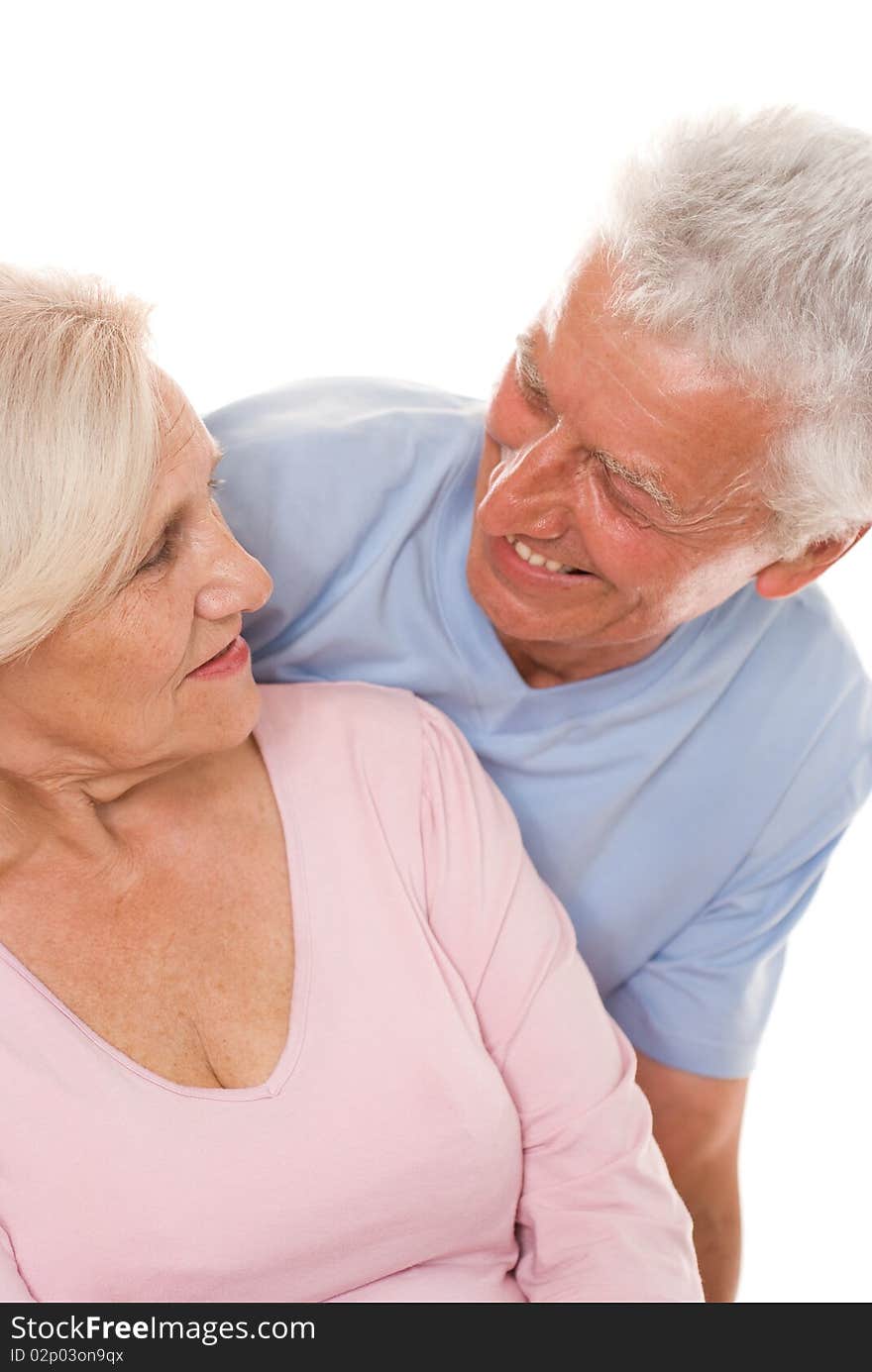 Happy elderly couple together on a white background