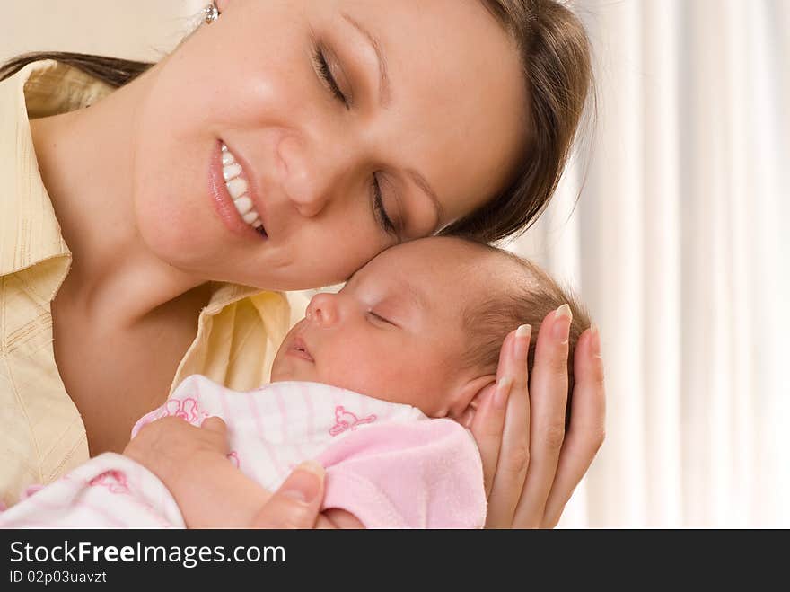 Mother Holds The Baby