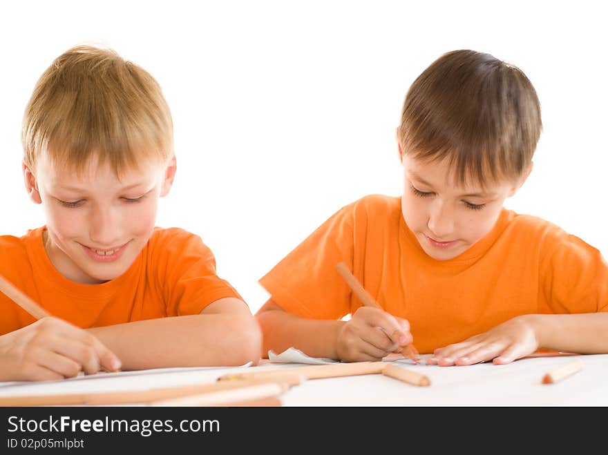 Two brothers paint on a white background