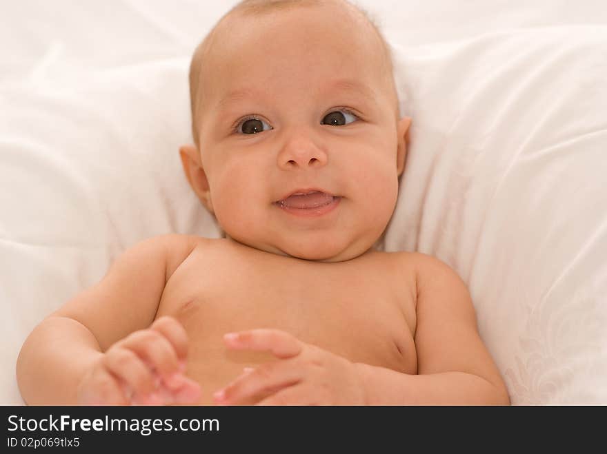 Portrait of a beautiful newborn baby on a white