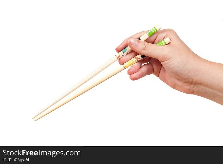 Female hand holding chopsticks on white. Female hand holding chopsticks on white