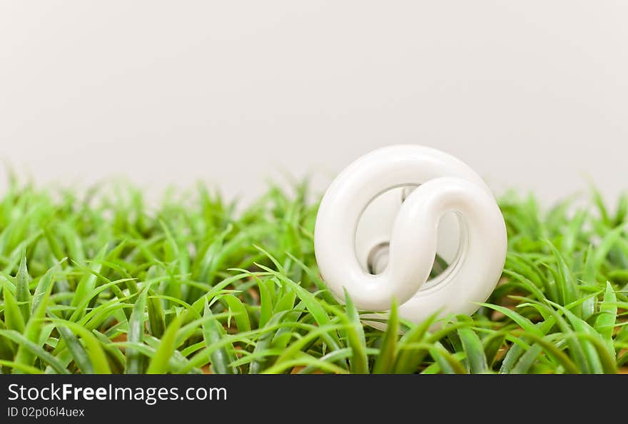 Energy Saving Light Bulb On Grass. Energy Saving Light Bulb On Grass