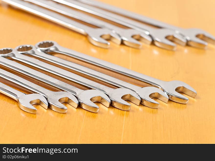 Hand wrenches on wood background. Hand wrenches on wood background