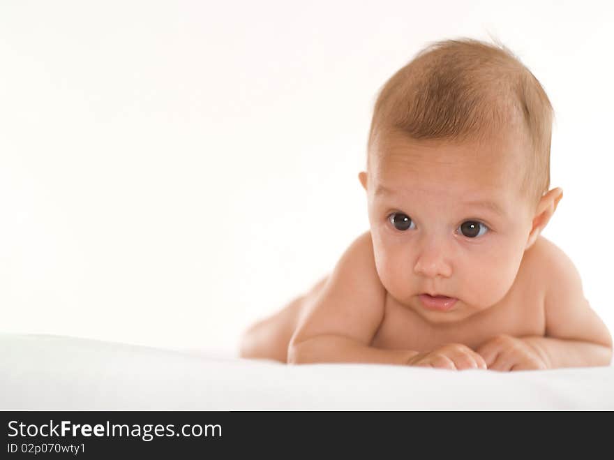 Portrait of a beautiful newborn baby on a white background