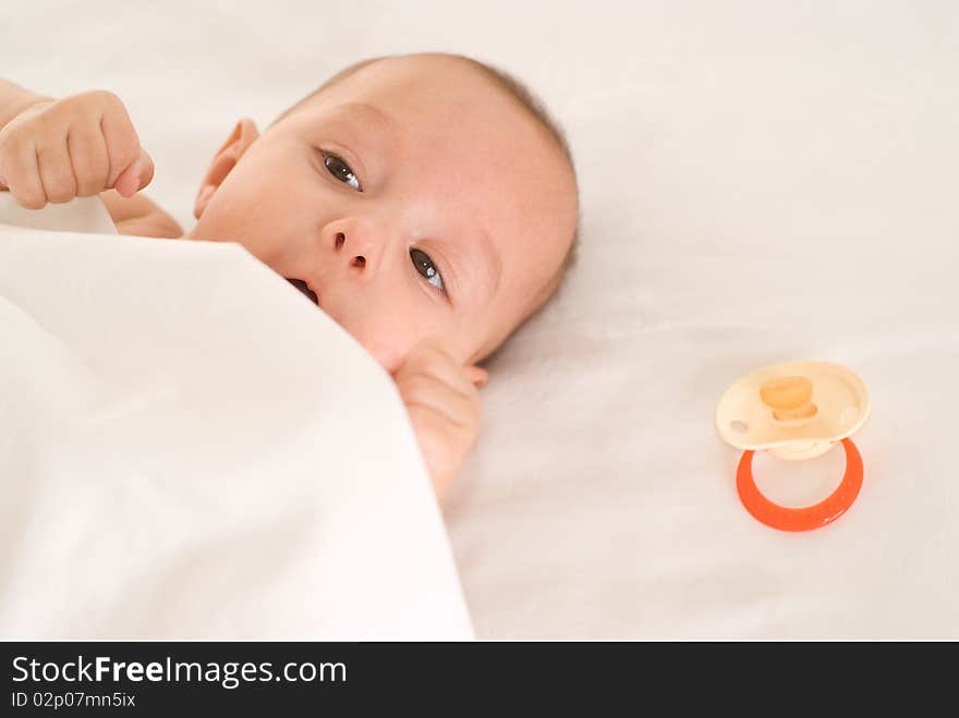 Portrait of a happy newborn  on a white