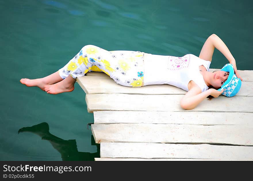 YOUNG GIRL BY LAKE