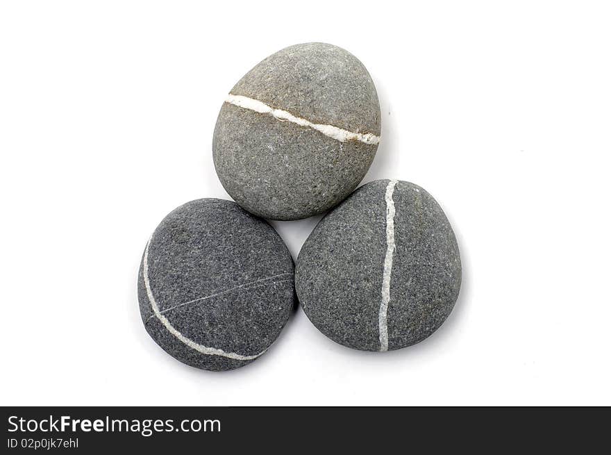 Three stones with white stripes