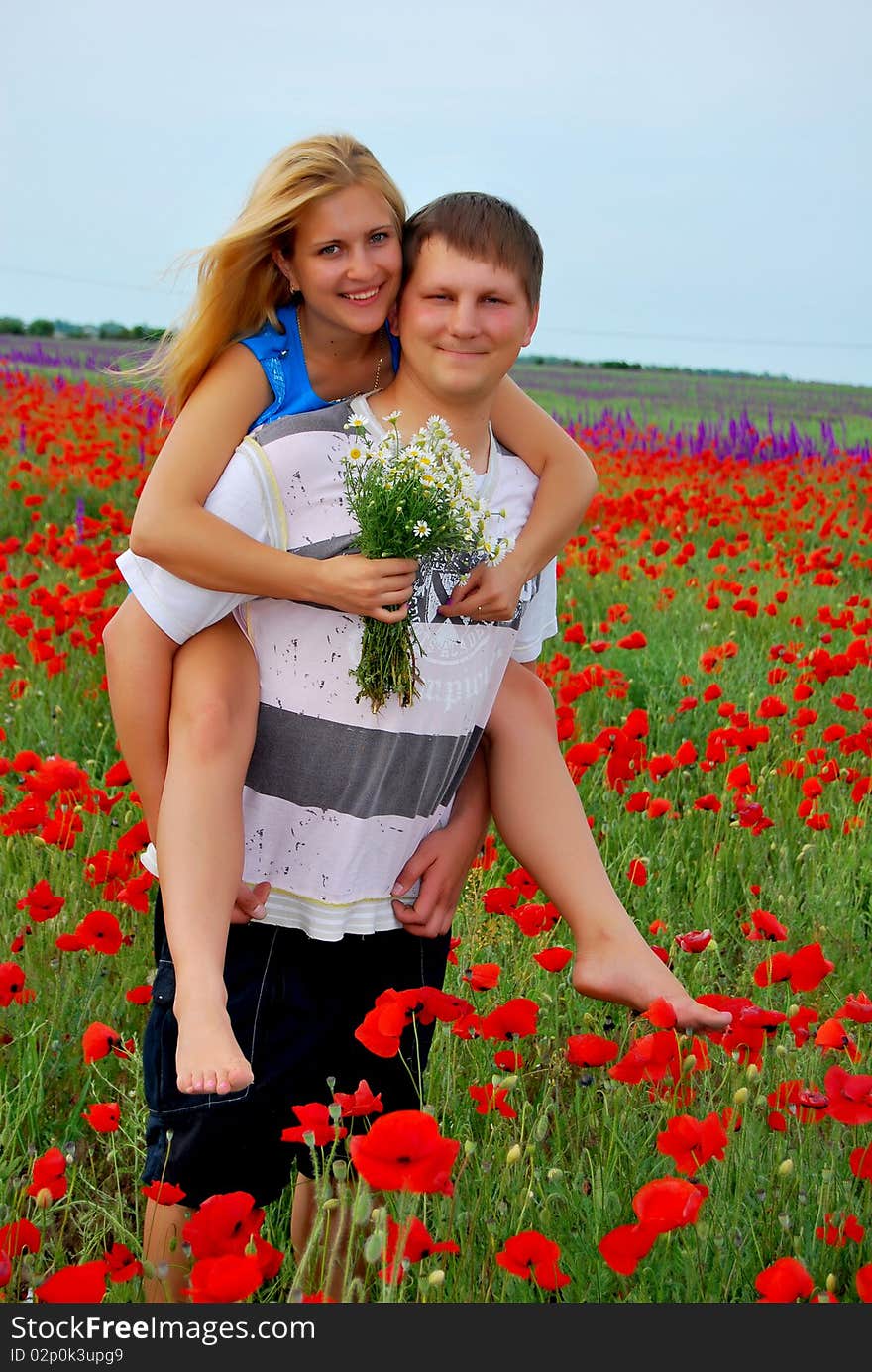 Loving couple in the meadow