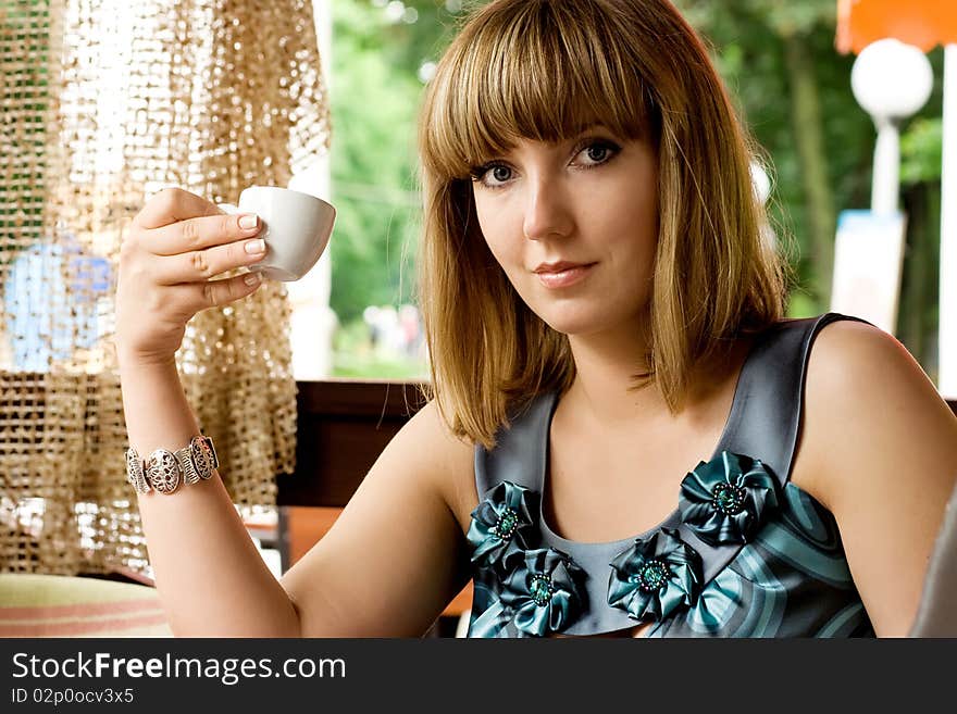 Sepia image of beautiful girl with coffee