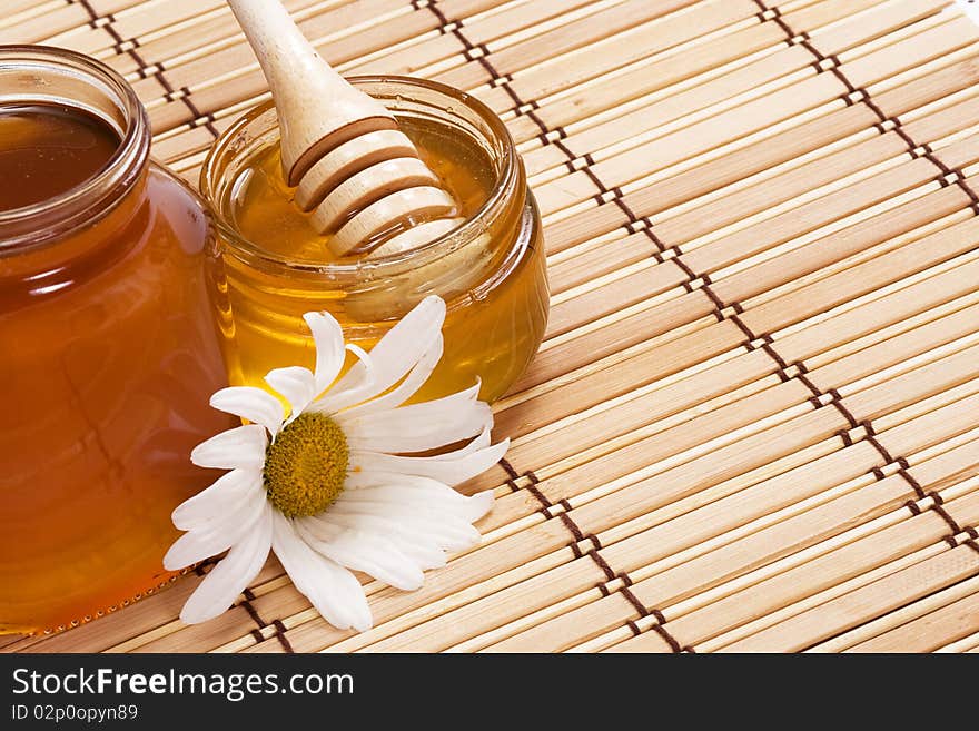 Glass pot full of honey. Glass pot full of honey