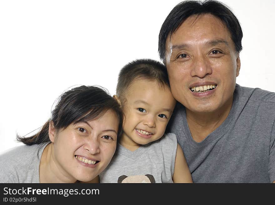 Asian mother, father and little boy. Isolated on white. Asian mother, father and little boy. Isolated on white