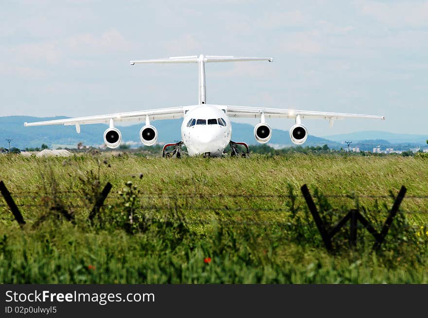 Small airplane waiting on the field