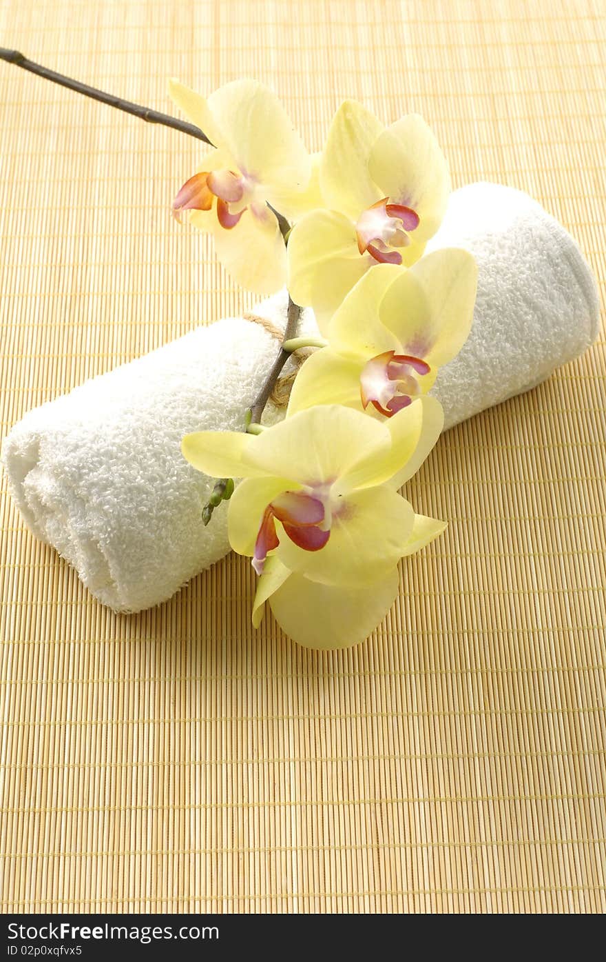 Spa concept white towel with orchid