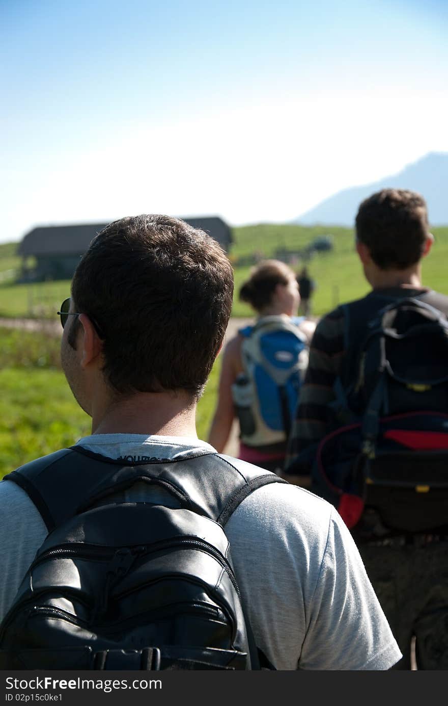 Women and men while hiking in the countryside. Women and men while hiking in the countryside