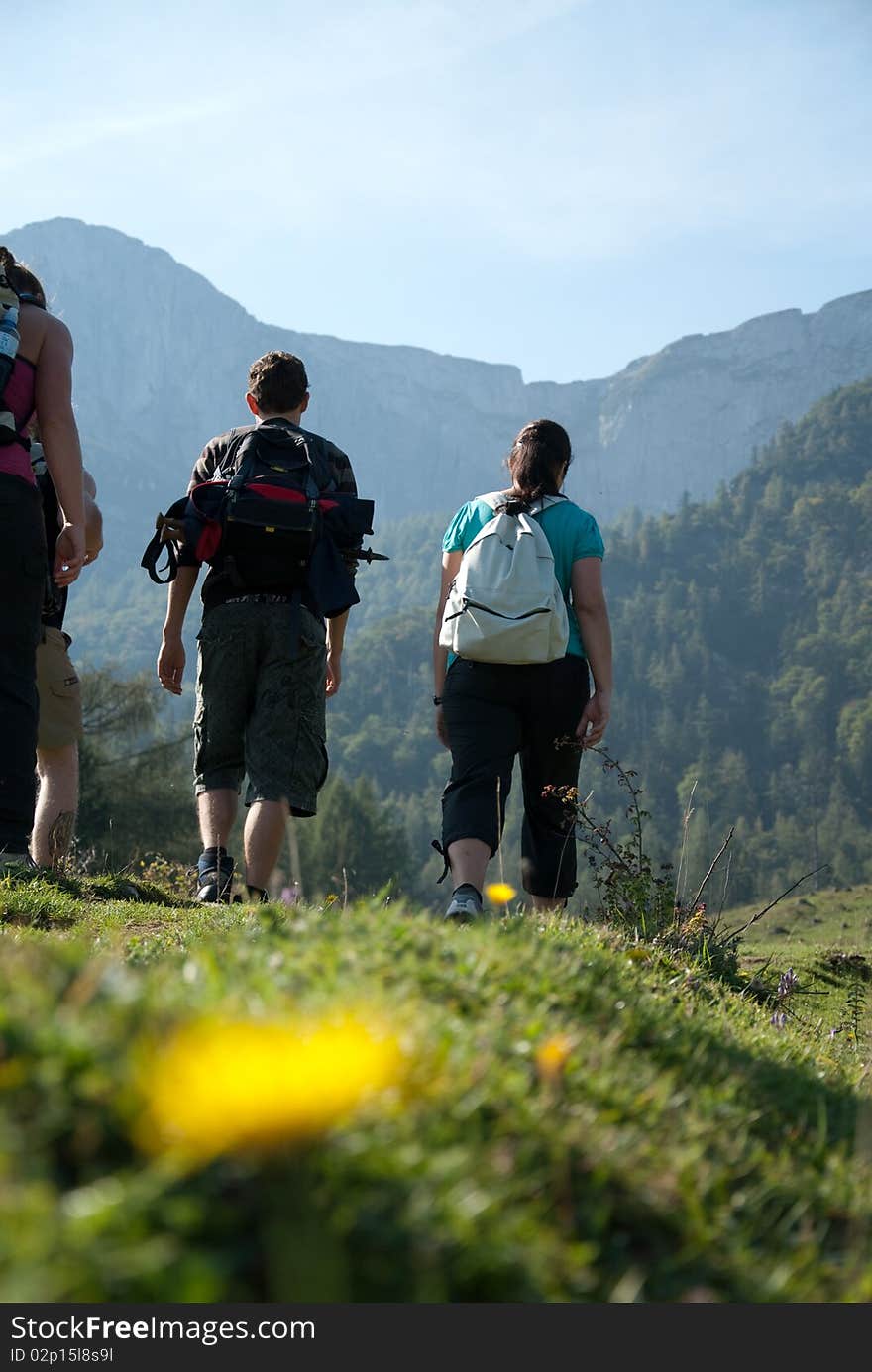 Women and men while hiking in the countryside. Women and men while hiking in the countryside