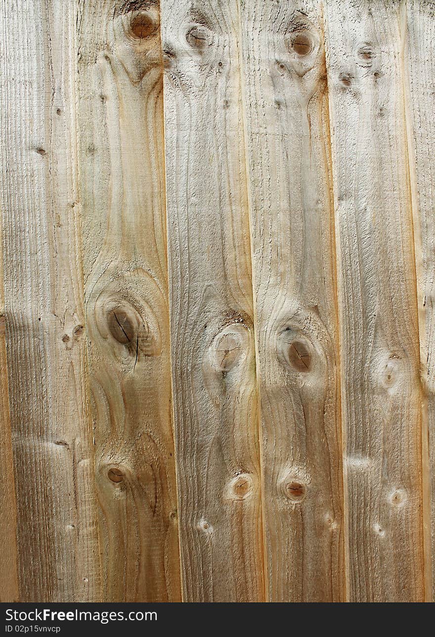 An abstract close up background of a wooden panel fence. An abstract close up background of a wooden panel fence