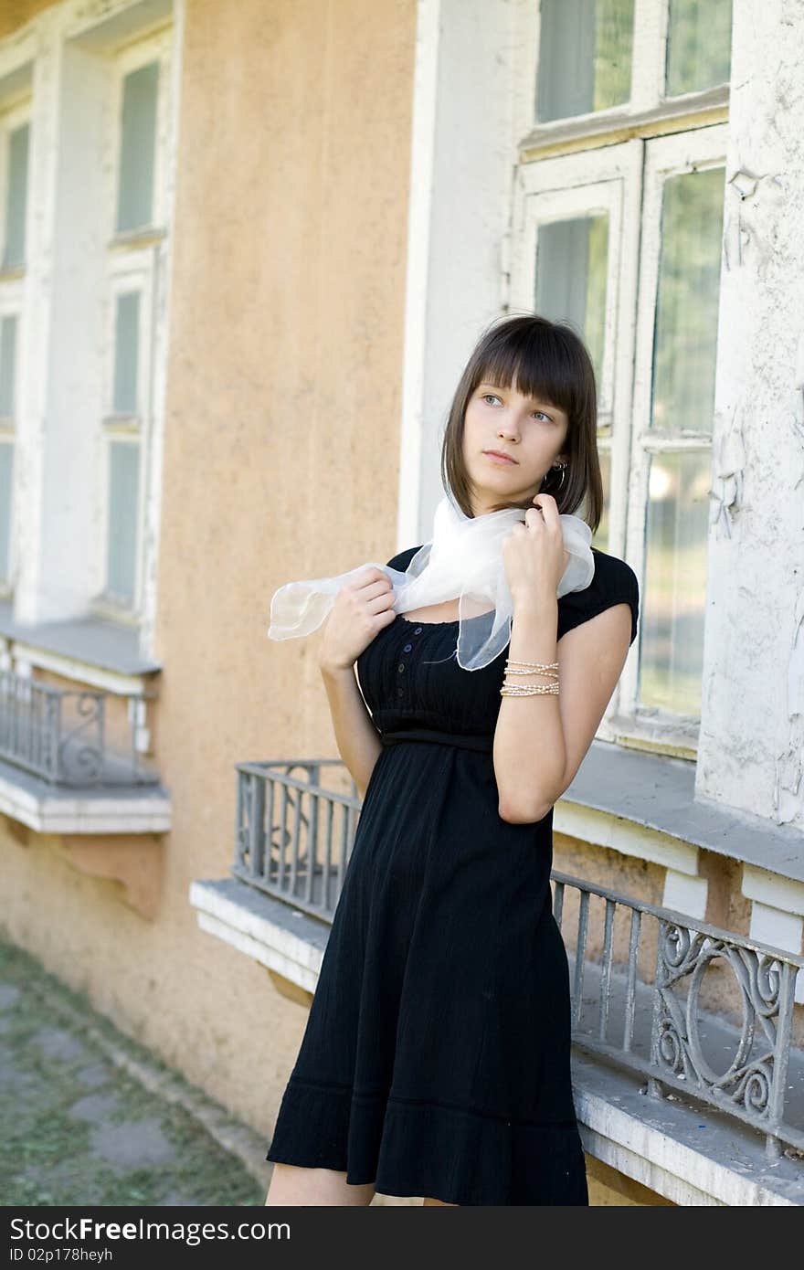 Girl Standing In Front Of A House