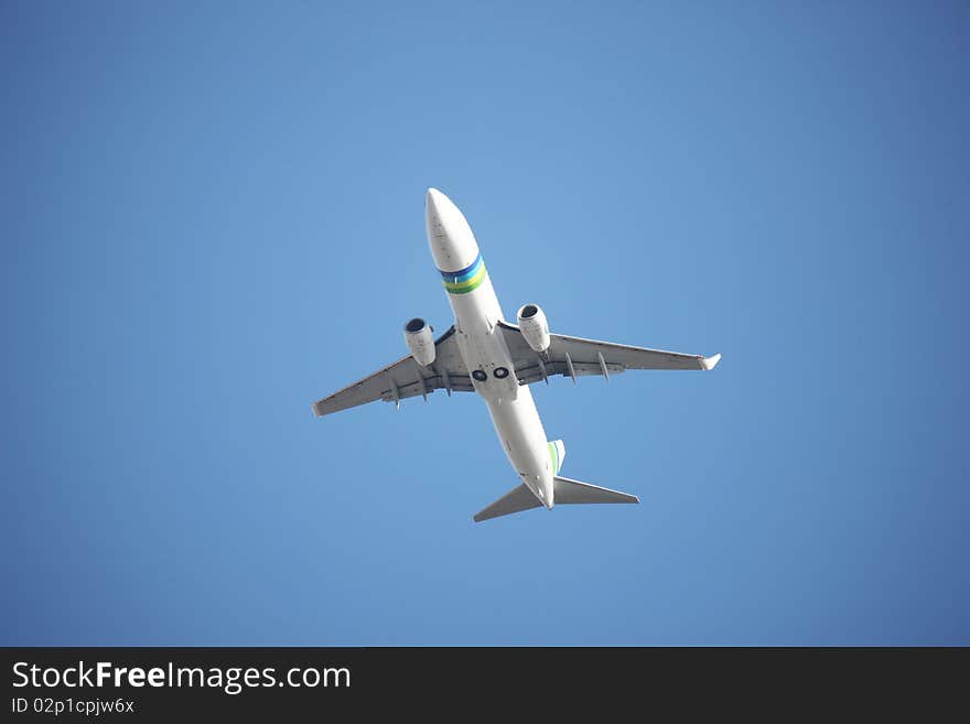 Airplane flying against a blue sky