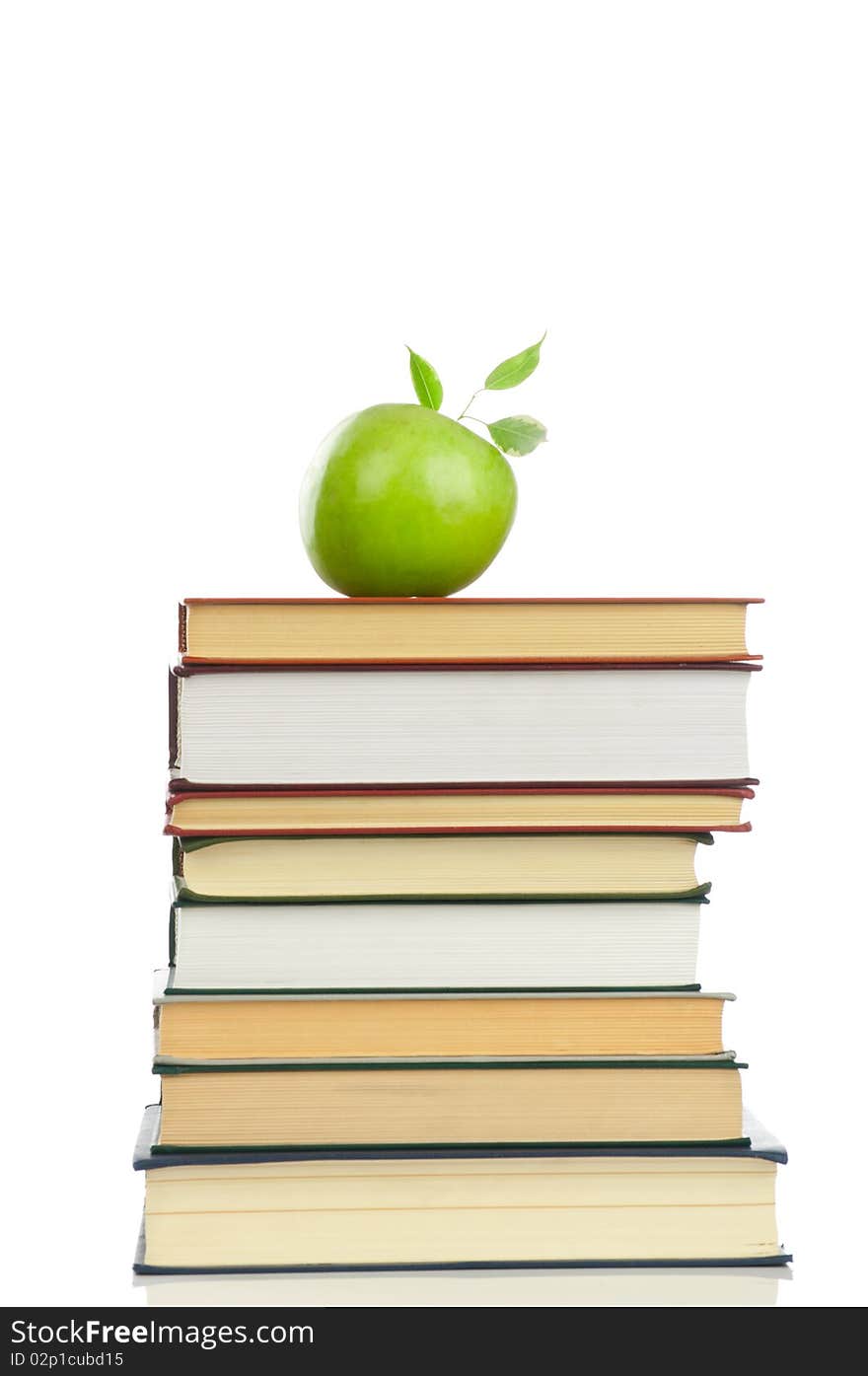 Book heap and an apple isolated on white background. Book heap and an apple isolated on white background