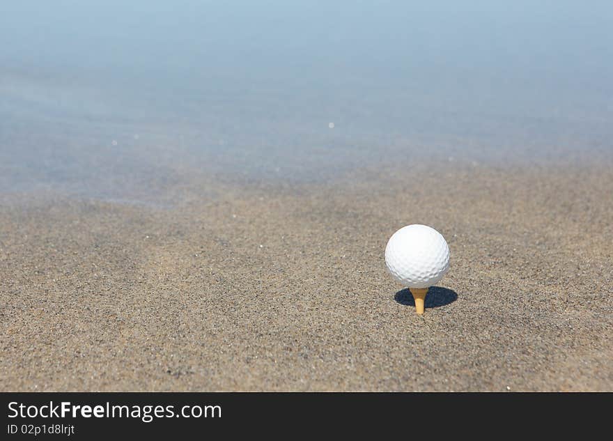 Golf ball in the beach