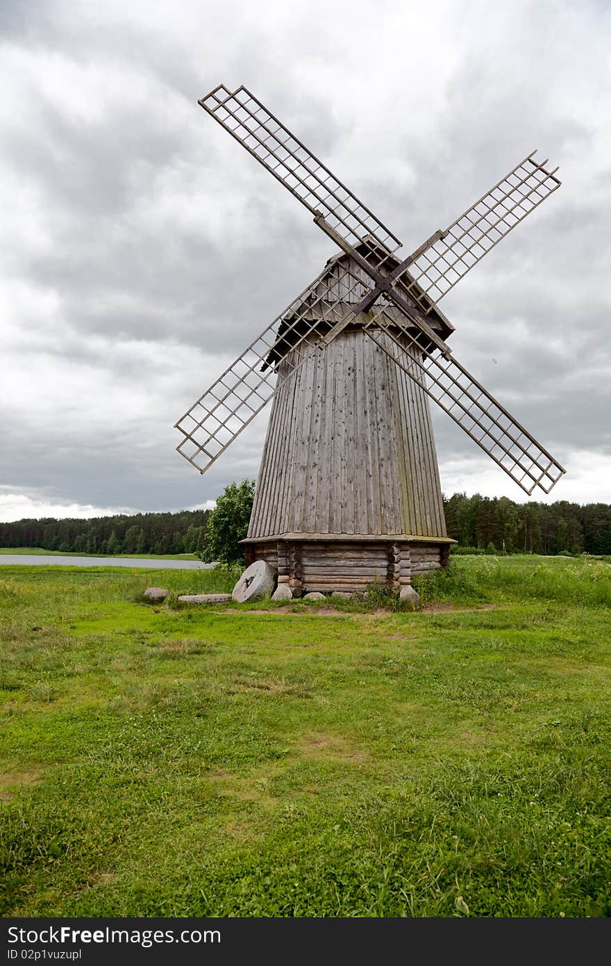 Old windmill on a meadow