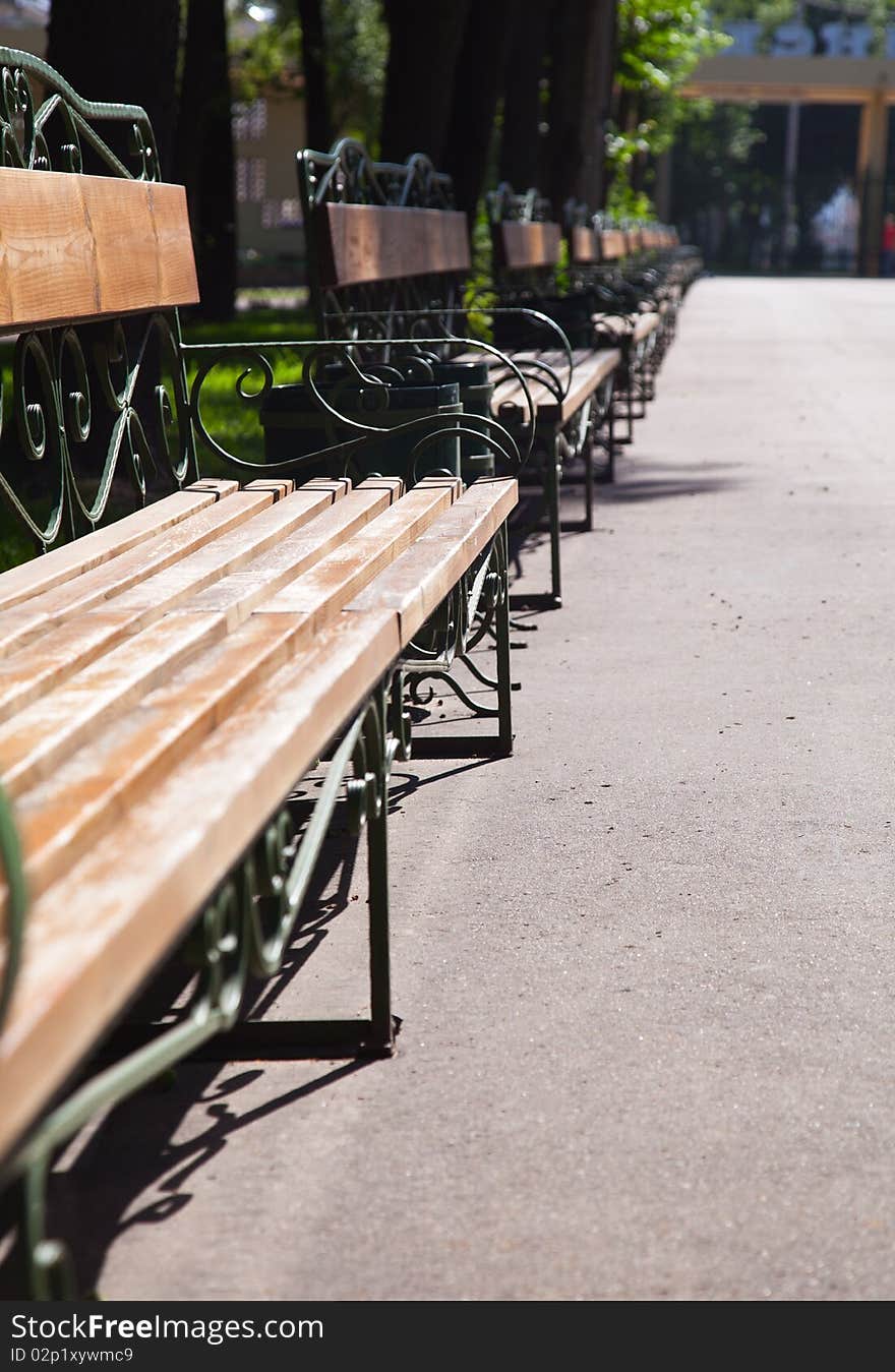 A line of benches in park. close-up