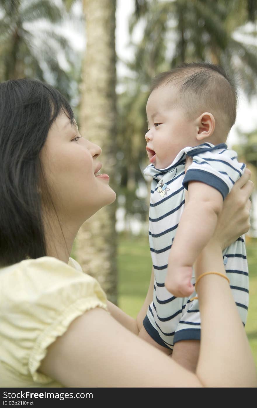 Asian young mother holding baby. Asian young mother holding baby