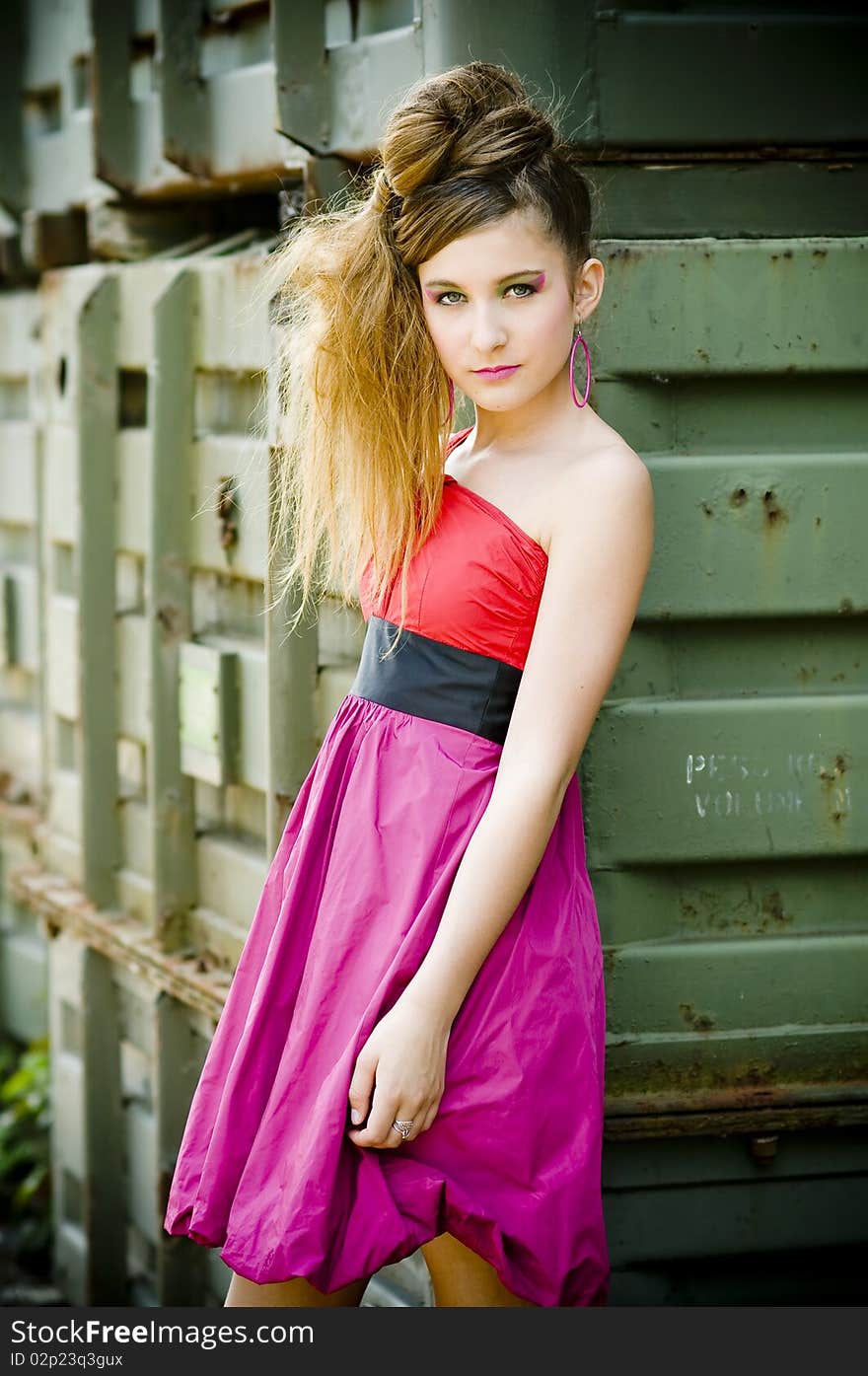 Teenage girl model presenting flashy clothes in old natural background. Teenage girl model presenting flashy clothes in old natural background