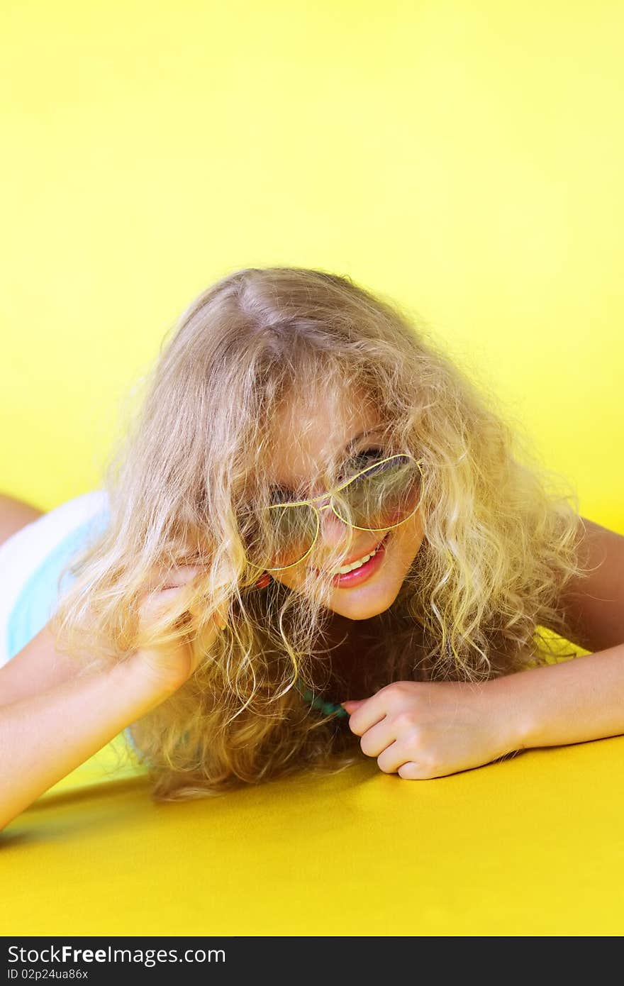 Beautiful girl on a yellow background