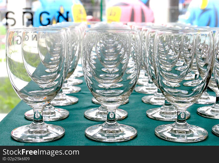 Several white wine glasses on table