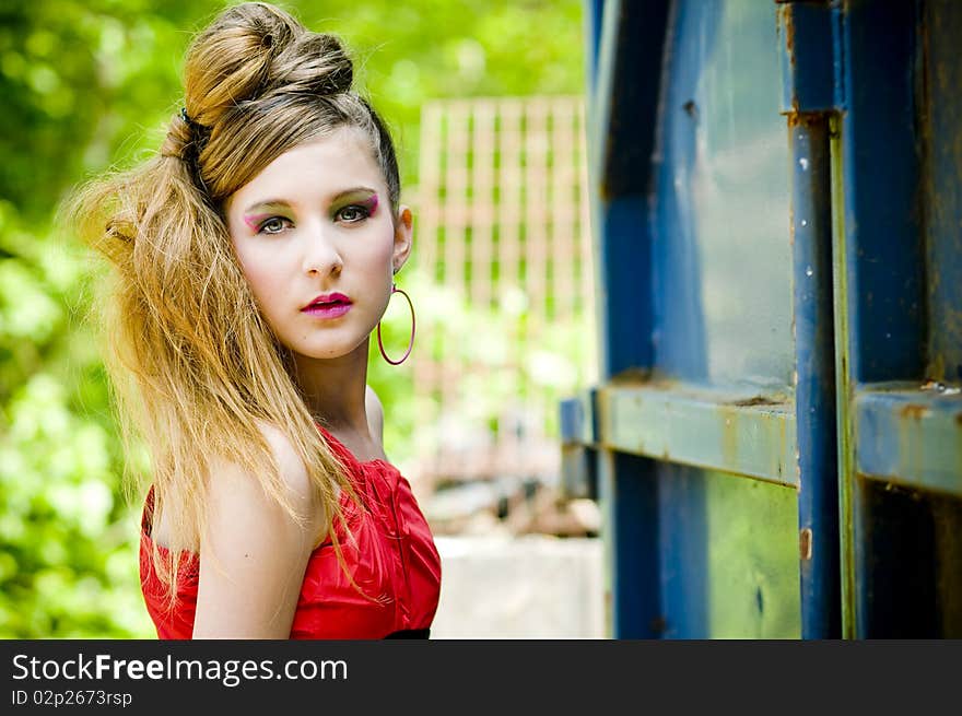 Teenage girl model presenting flashy clothes in old natural background. Teenage girl model presenting flashy clothes in old natural background