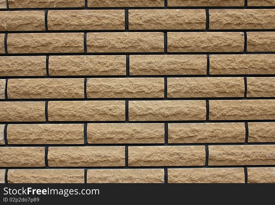 The wall of brown brick