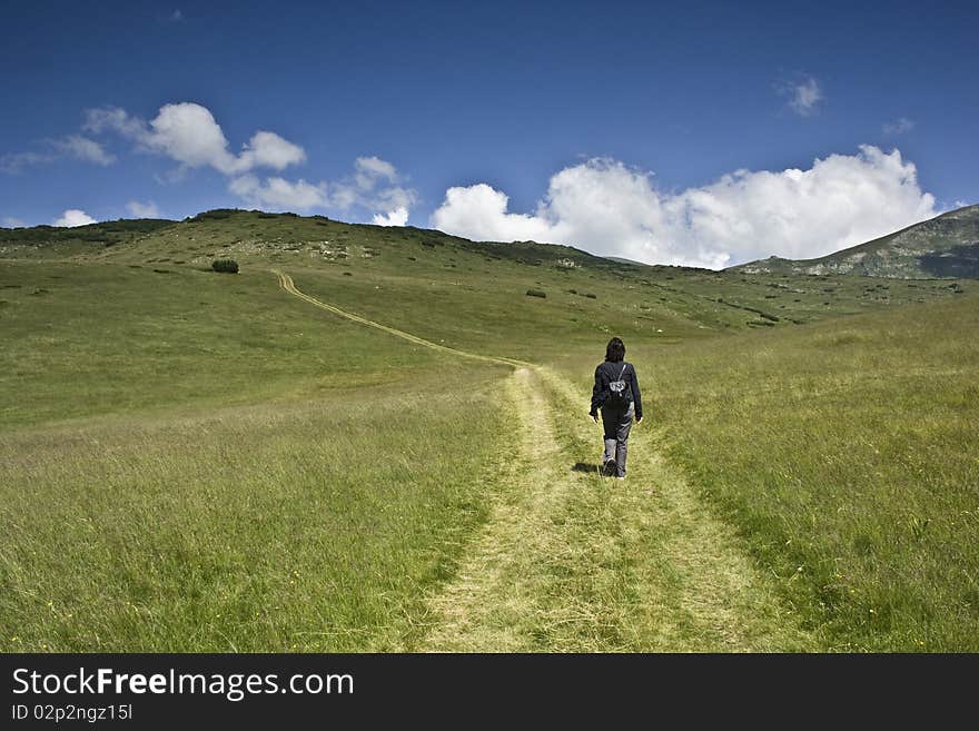 A woman in high mountain. A woman in high mountain