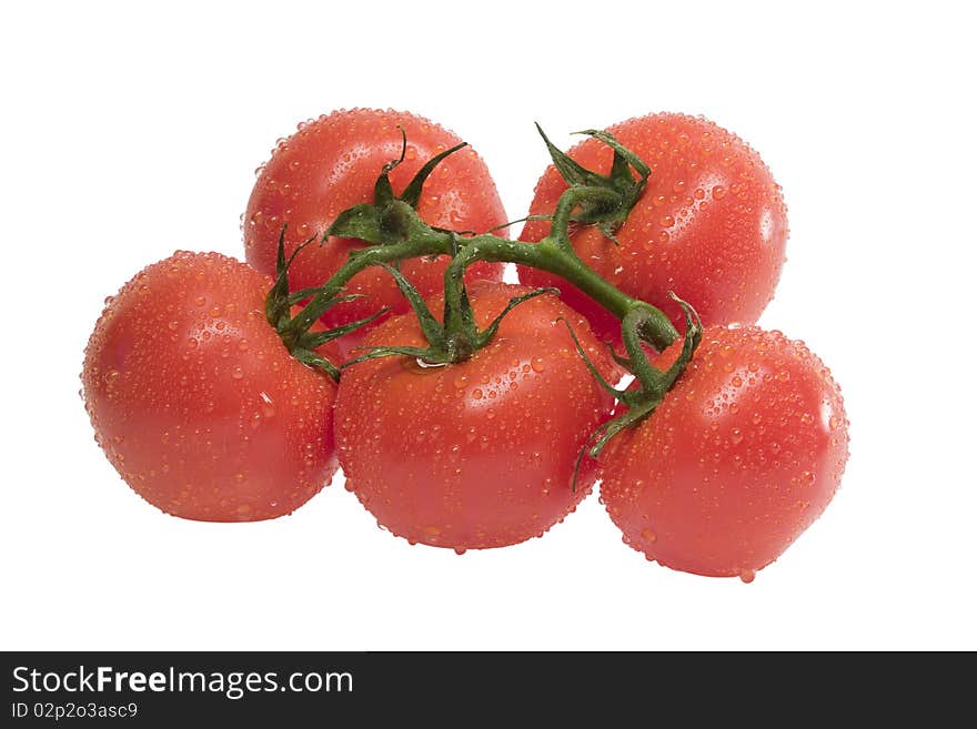 Group Of Ripe Tomatoes With Leaf On A Stem