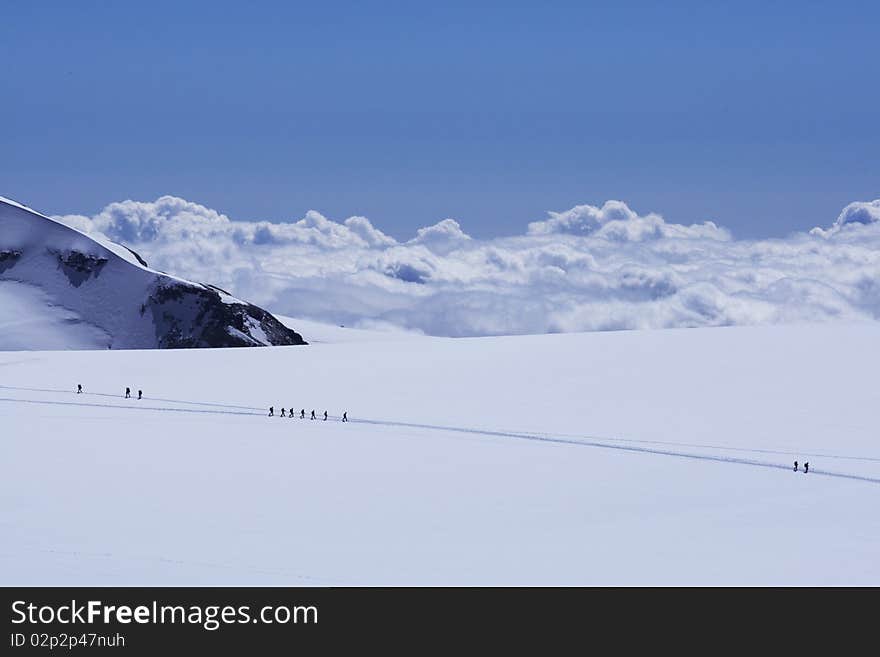 Clouds below the peaks of the Alps